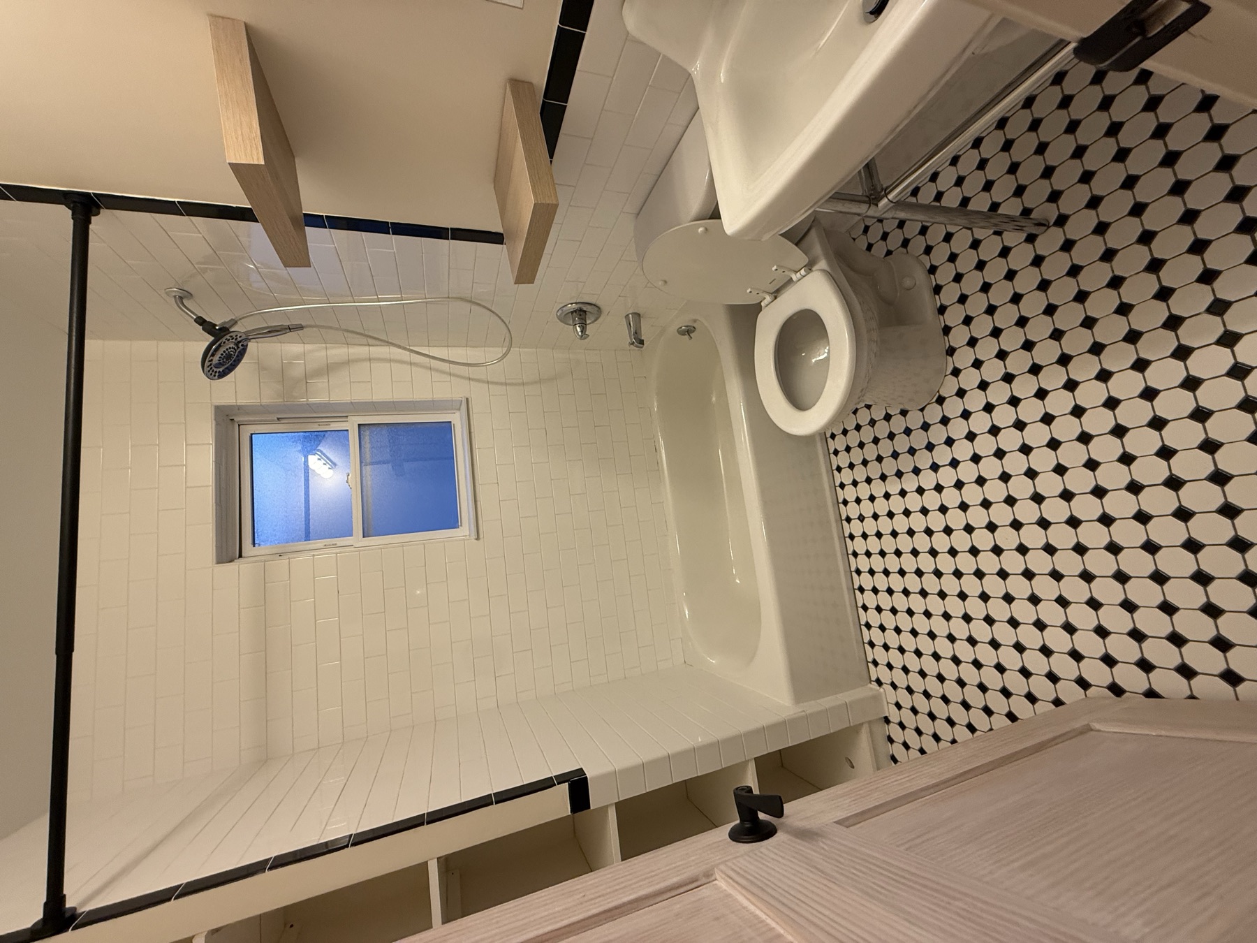Clean bathroom with bathtub and patterned tile after move-in cleaning in Bayside