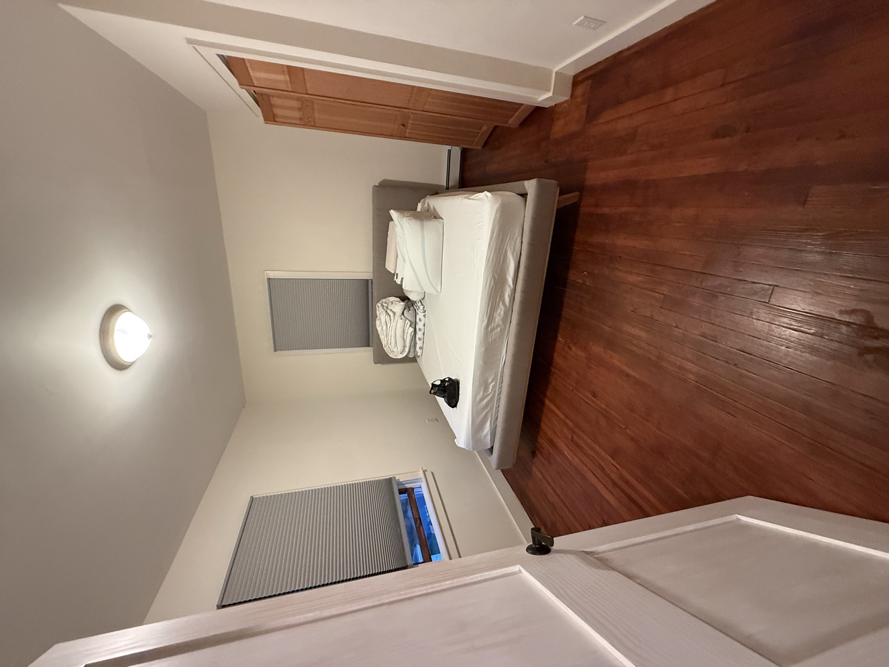 Clean bedroom and polished hardwood floor after Bayside move-in cleaning