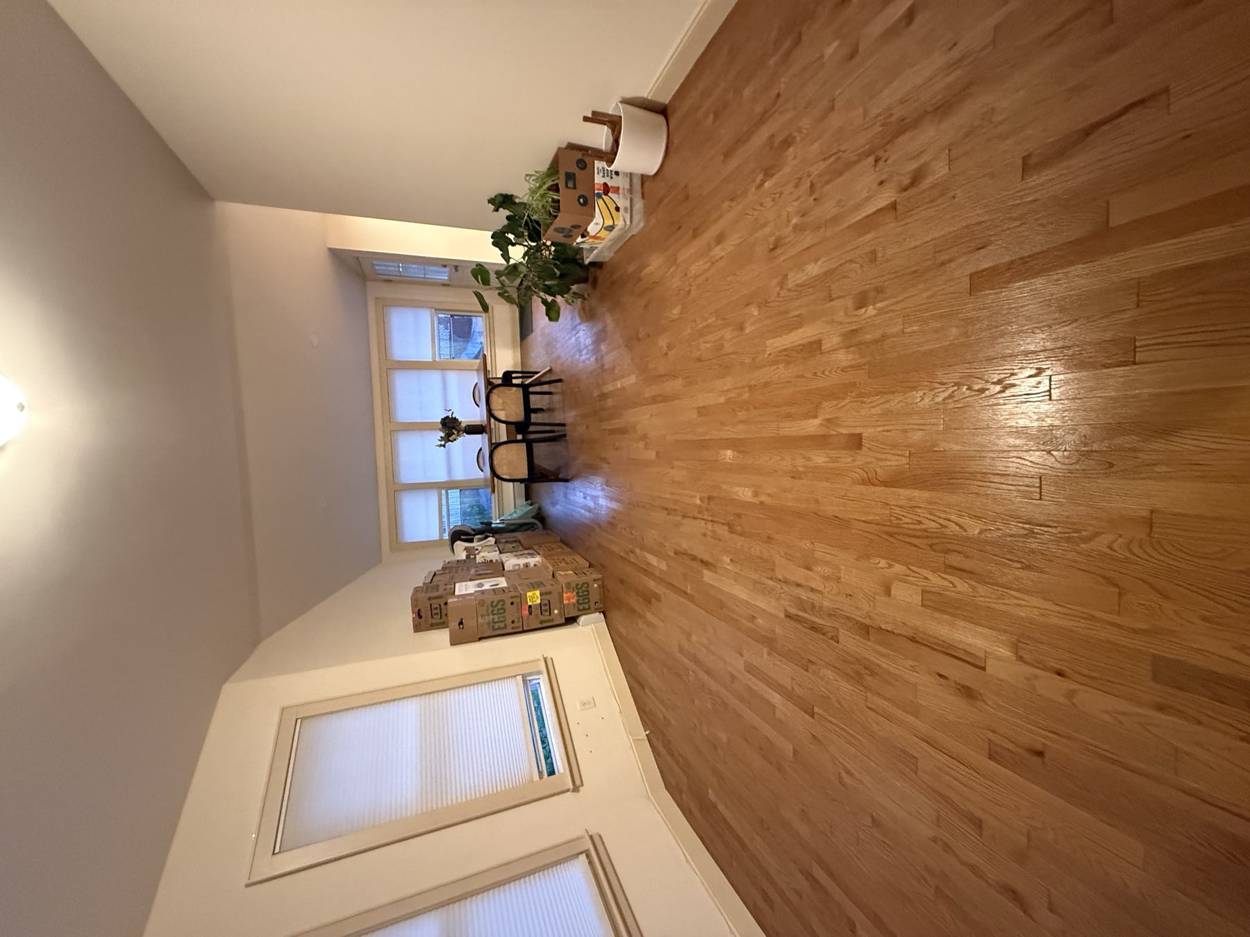 Clean living room with polished hardwood floor after move-in cleaning in Bayside, Queens