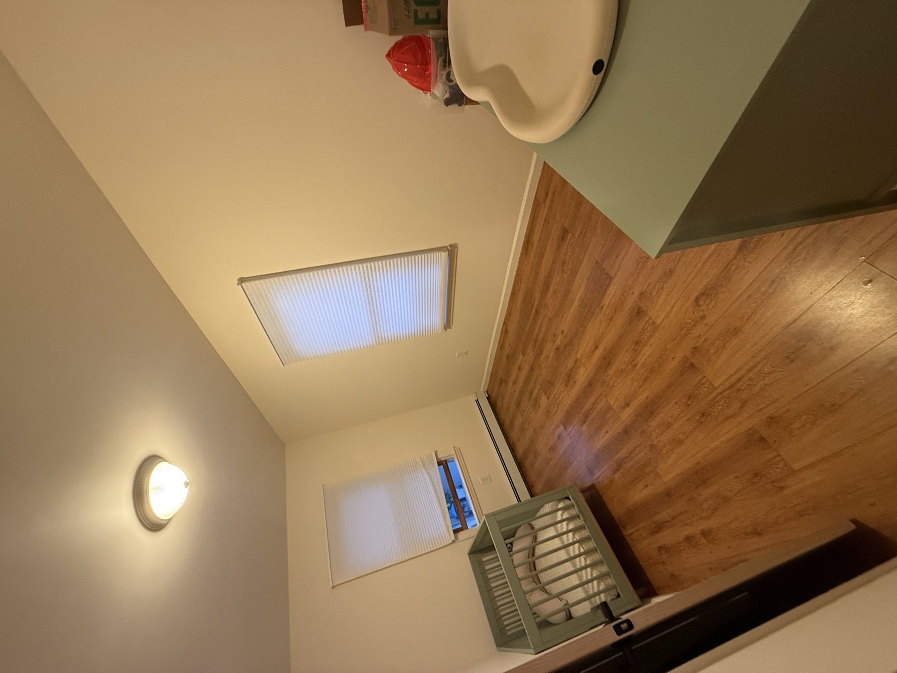 Clean second bedroom prepared for a family relocating to Bayside, Queens