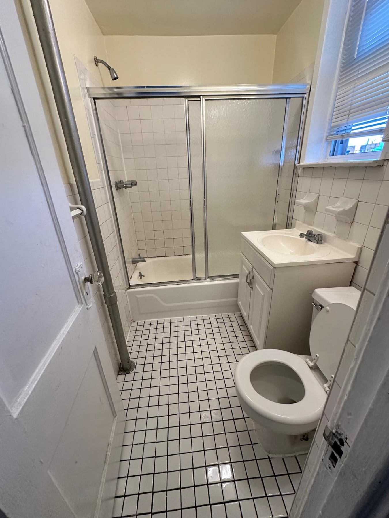 Bright, refreshed bathroom after detailed surface cleaning by Iman Cleaning Service