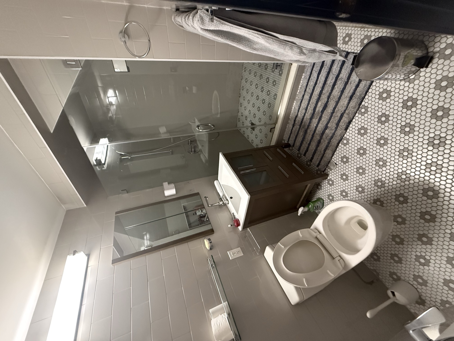 Clean bathroom, shower, vanity, and floor after apartment turnover cleaning in New York City