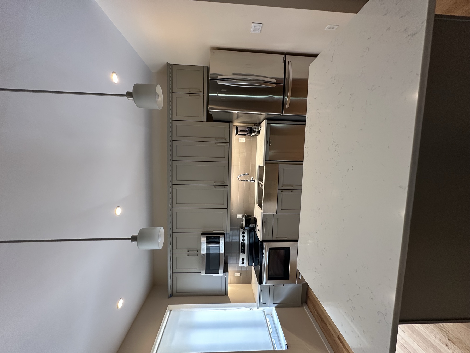 Clean kitchen and island after landlord apartment turnover cleaning in New York City