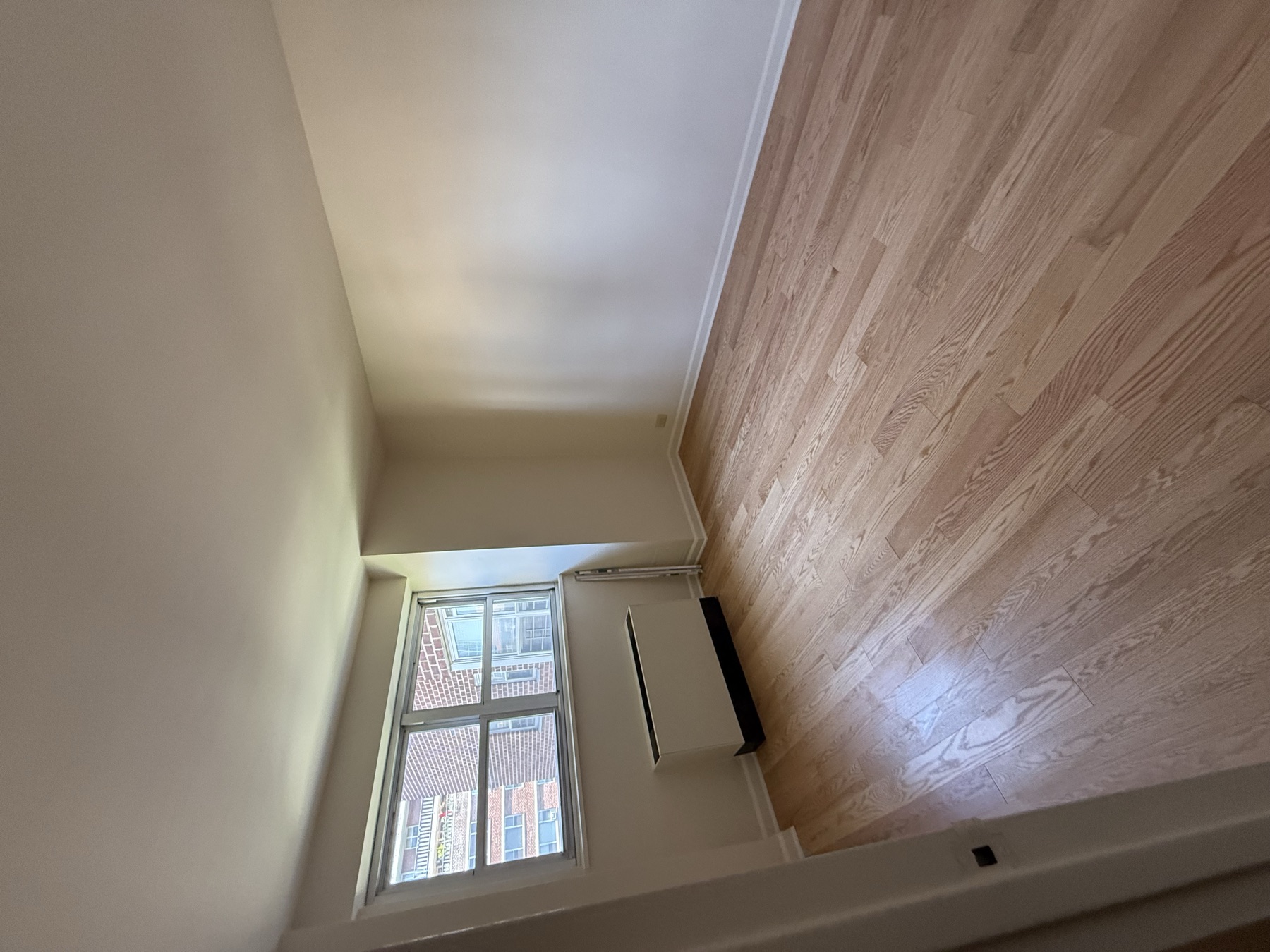Clean bedroom and hardwood floor after move-in apartment cleaning in Manhattan