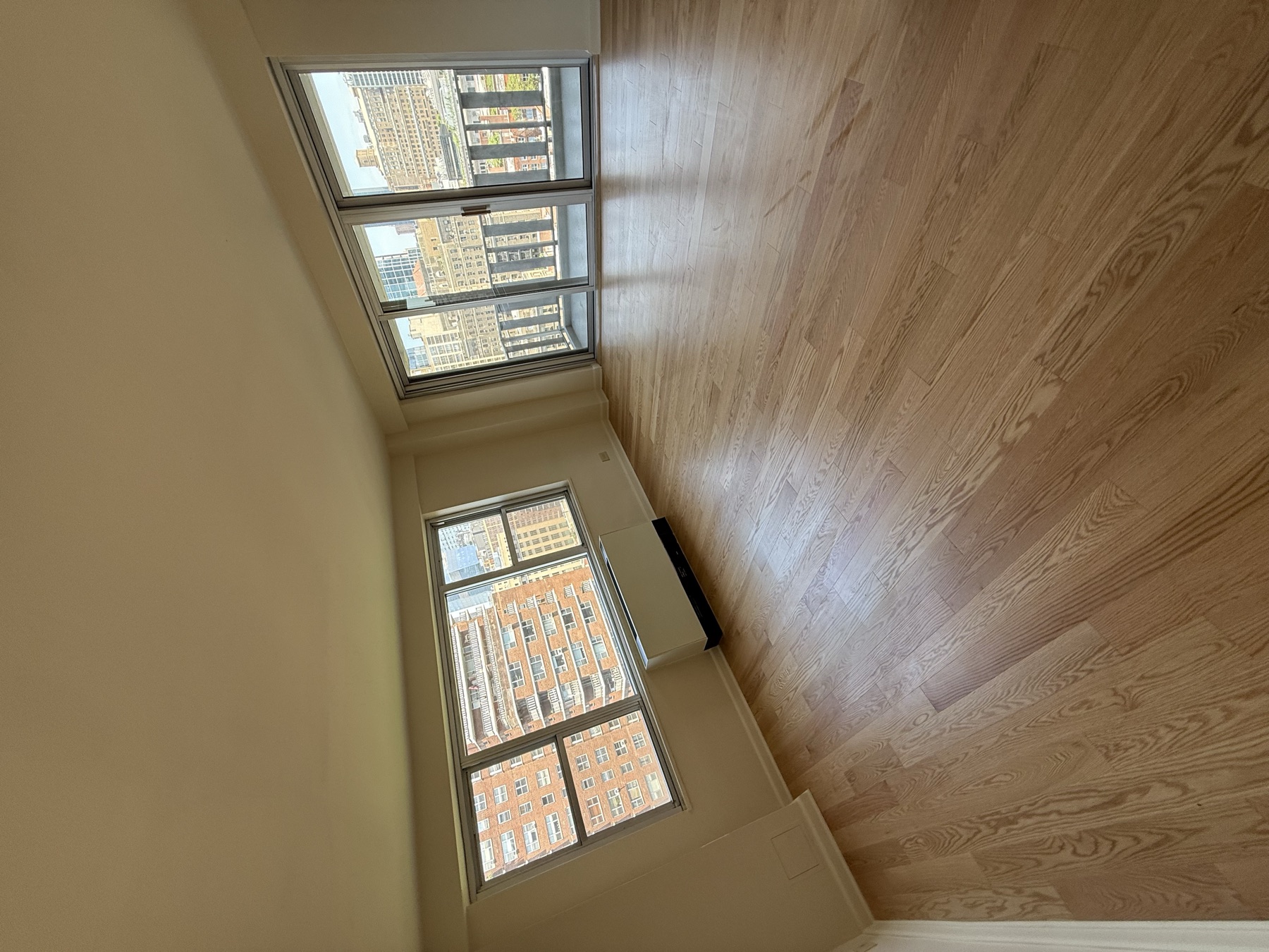Bright clean living room with Manhattan views after move-in apartment cleaning