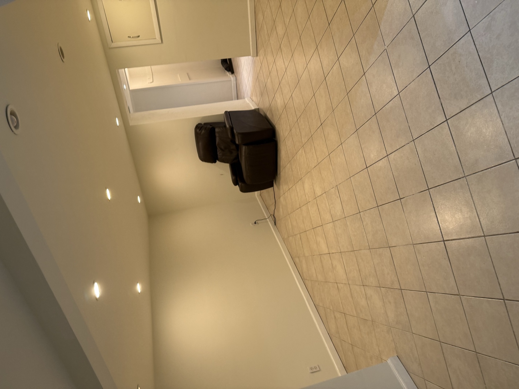 Clean empty tiled room prepared before a family moves into a New York City home