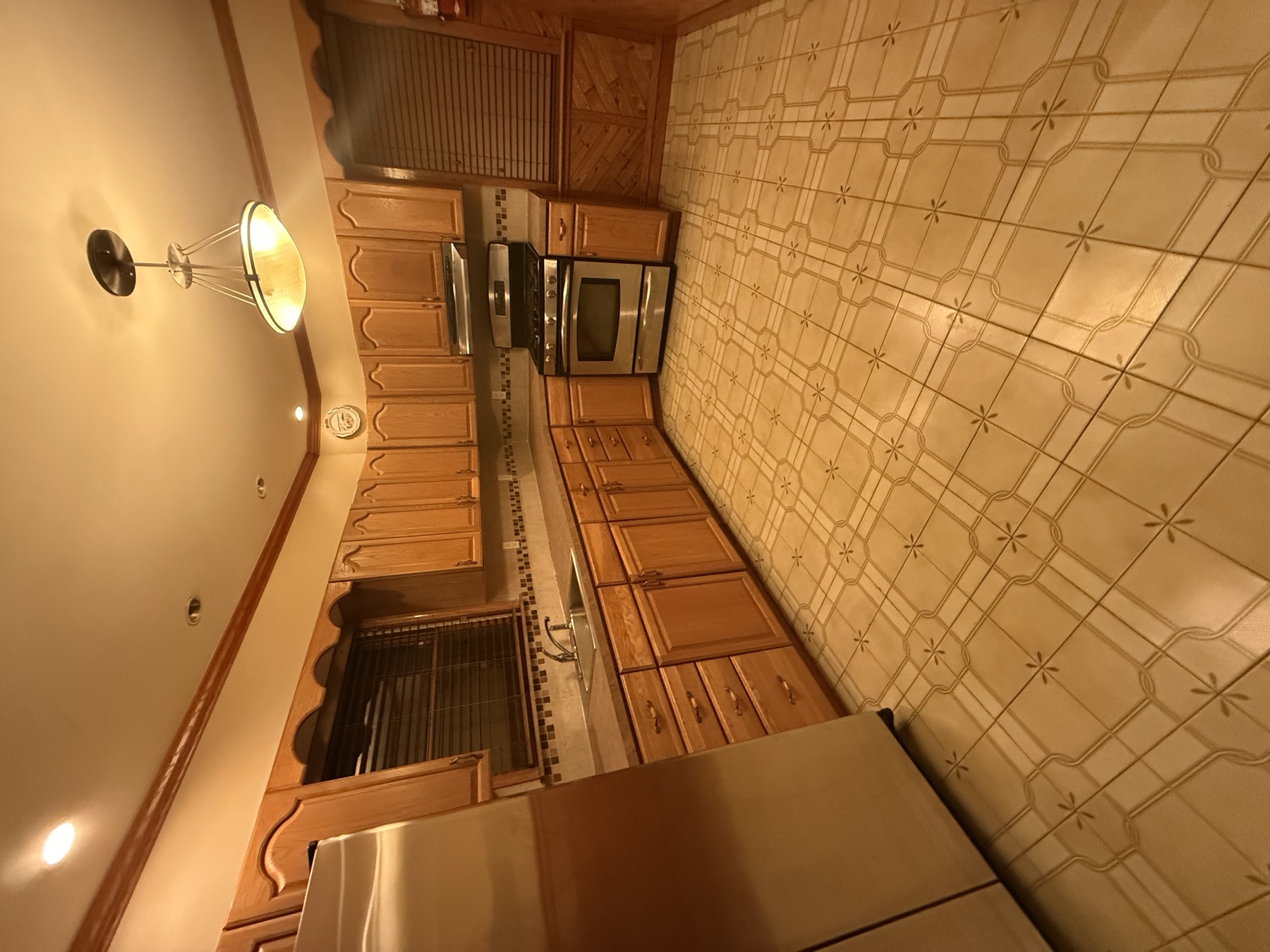 Clean kitchen, cabinets, counters, appliances, and floor before a home sale listing