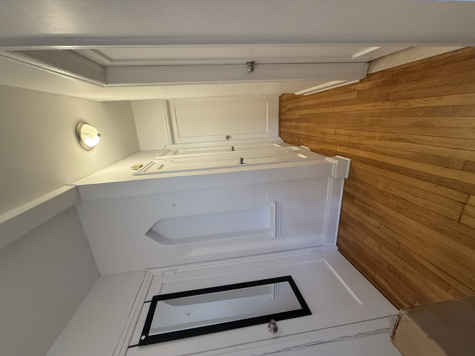 Clean apartment hallway and hardwood floor after move-in cleaning in Queens