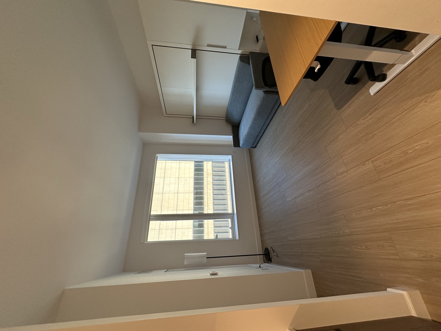 Clean studio apartment living and sleeping area after monthly standard cleaning in New York City