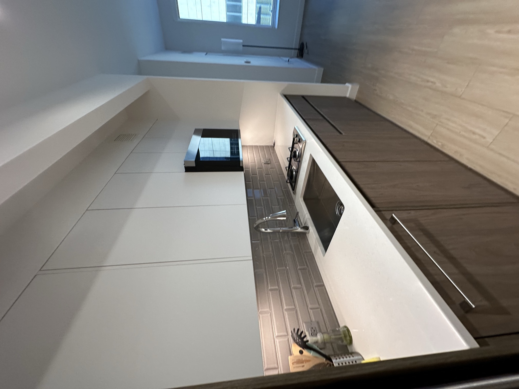Clean studio apartment kitchenette after monthly standard cleaning in New York City