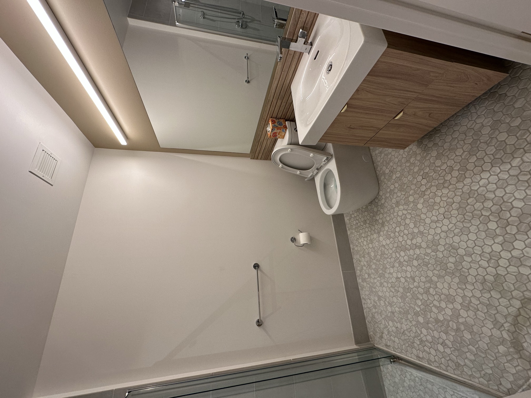 Clean studio apartment bathroom after monthly standard cleaning in New York City
