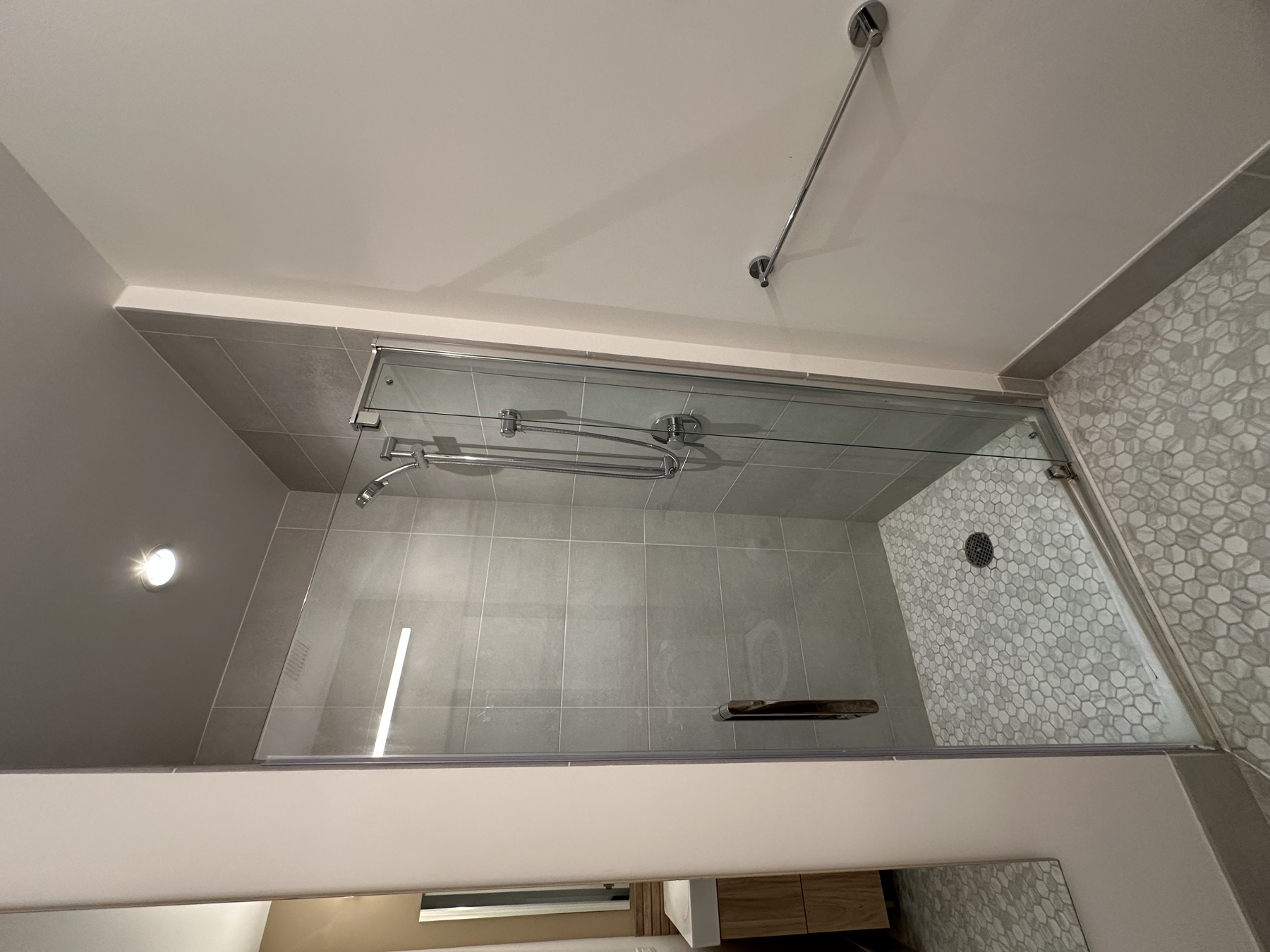 Clean glass shower after monthly studio apartment cleaning in New York City